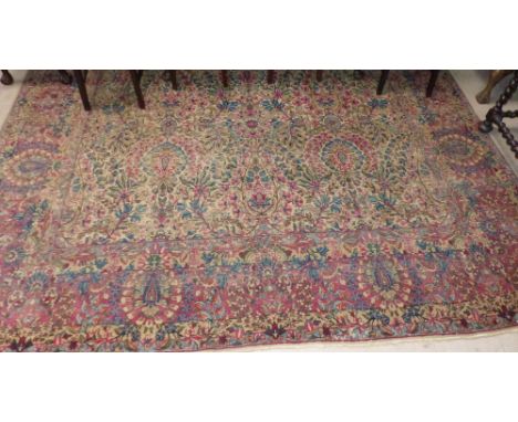 A 20th century Kerman style hand knotted Persian carpet with multiple border and stylized flowers to the ground, 360 x 275 mm