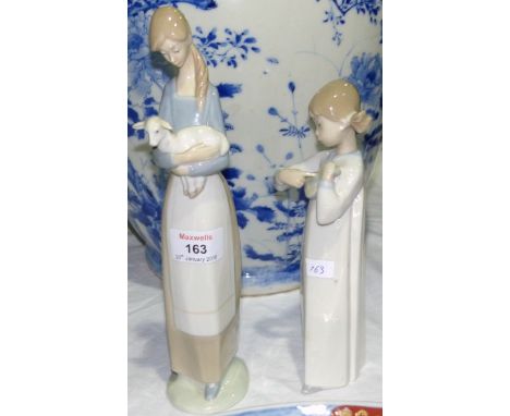 Two Lladro figures:  girl with lamb, height 11"; girl in nightdress, height 9" (a.f.)