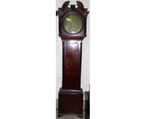 A late 18th century oak and mahogany longcase clock with swan neck pediment and turned columns to the hood, twin arch full le