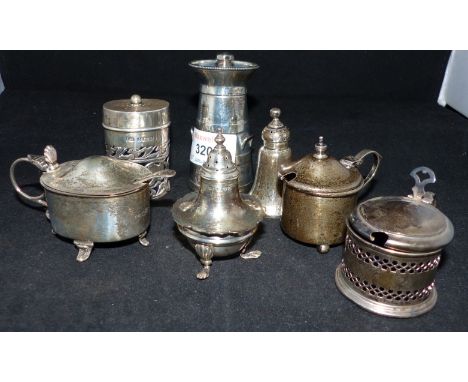 A churn shaped silver pepper grinder, London 1893 and six other cruet pieces 
