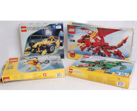 LEGO; A collection of four vintage Lego building sets to include 4094 Inventor, 5868 Creator, 6751 Creator and 8445 Technics.