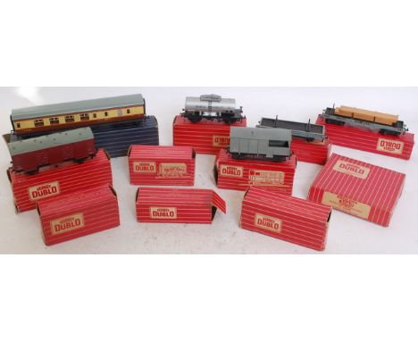 HORNBY; A collection of Hornby Dublo vintage tenders and carriages; 4312, 4680, 4665, 4675, 4610 and accessories

NOTE: This 