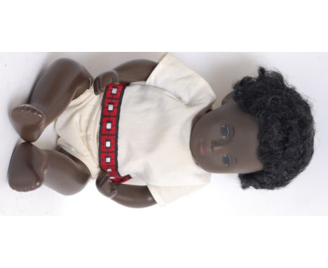 SASHA DOLL; An original vintage 1960's vinyl black Sasha Doll baby complete with original clothing - white top.

Sasha dolls 