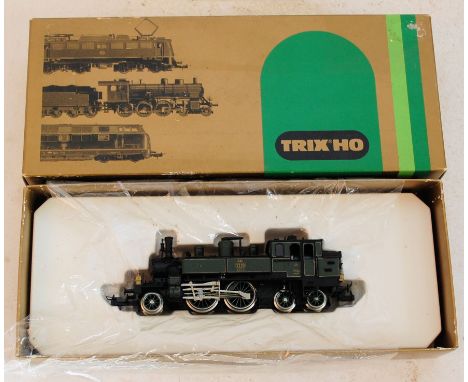 TRIX: An original vintage Trix HO Gauge railway trainset locomotive 2430 locomotive in original box.

NOTE: This lot comes fr