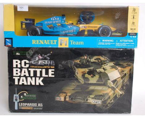 Two remote control vehicles: The first being a Renault Formula One racing car 1:12 scale, the second being an RC Battle Tank 