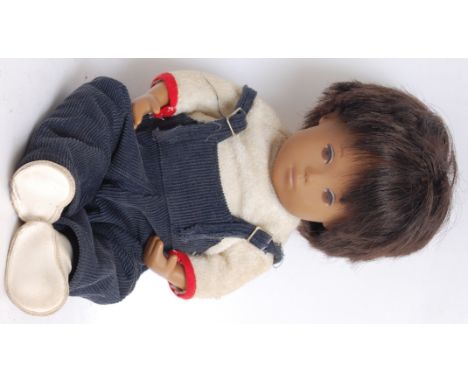 SASHA DOLL; An original vintage 1960's vinyl baby Sasha Doll, complete with original clothing; white top and blue dungarees. 