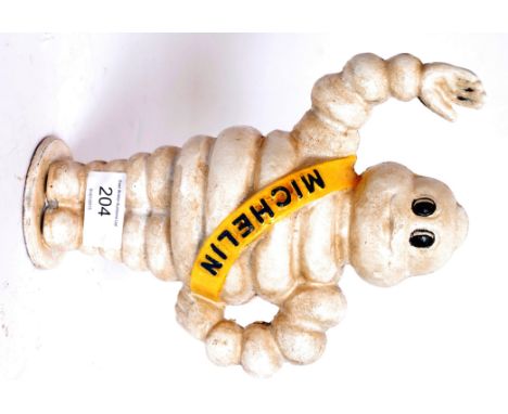 A vintage style cast iron Michelin Man statue / money box. 