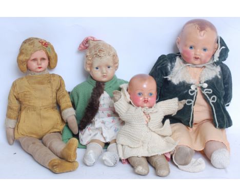 DOLLS; A good collection of four vintage / antique dolls - including composition headed, early plastic headed doll, rag bodie