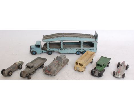 DINKY; A collection of 7x vintage Dinky diecast model vehicles to include Transporter, 2x racing cars, flatbeds, trucks etc. 