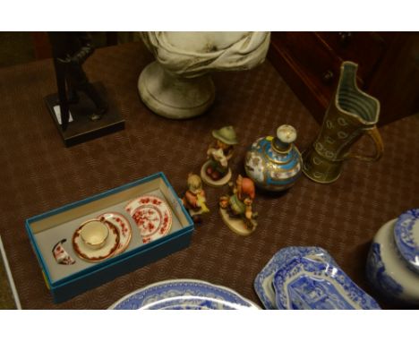Three various Goebel figures; a small continental porcelain scent bottle decorated with a bird; a stoneware jug; a miniature 