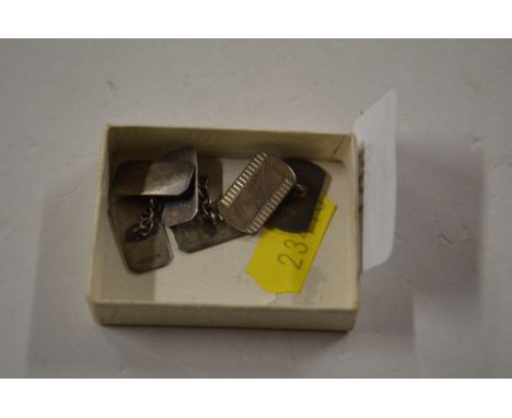 A pair of silver engine turned cuff-links and one other 