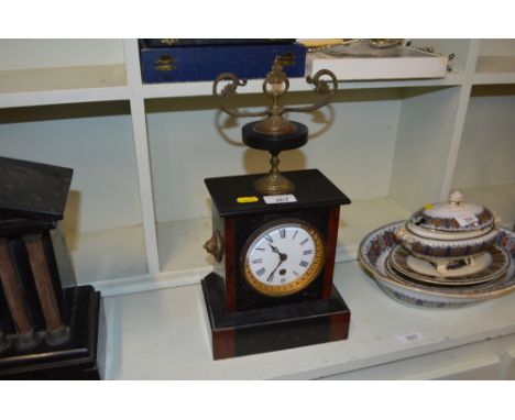 A late Victorian black slate and marble single hole mantel clock 