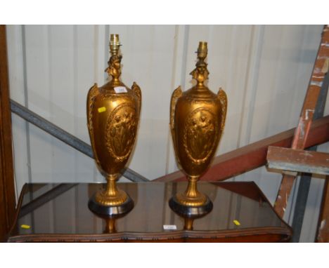 A pair of gilt metal figural decorated table lamp bases 