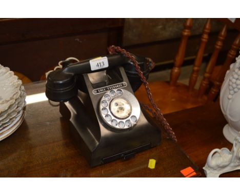 A Bakelite cased rotary telephone