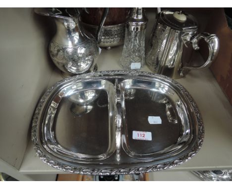 A selection of plated ware including dish, water jug, vegetable dish, teapot and treen biscuit barrel with plated lid and rim