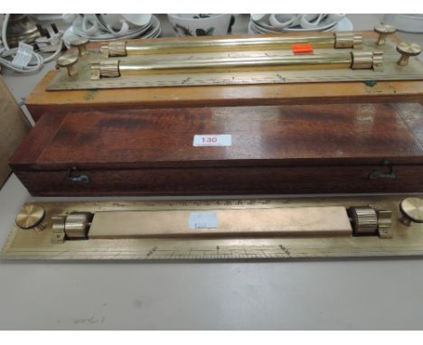 A selection of vintage architectural, design and measuring devices. Including treen boxed solid brass sliding rulers