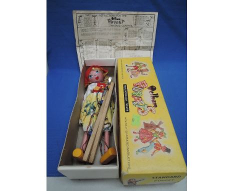 A Pelham puppet, SS Tyrolean girl in original box along with instruction leaflet