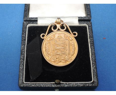 A 9ct gold Football Association medal in mount,  to commemorate 20 years service on the council, presented to M Brewitt, weig