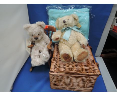 A modern Merrythought teddy bear having F&M on foot pad with blanket and basket and a similar Charlie bear with rocking chair