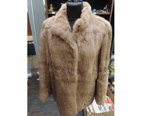 A ladies 3/4 length taupe sheepskin coat by Baily's of Glastonbury