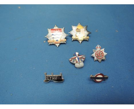Six vintage enamel badges including London and Eastham Fire Brigade, Leyland etc