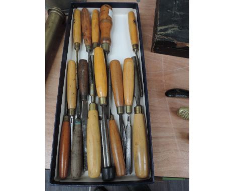 A selection of vintage fruitwood handle wood turning tools and chisels