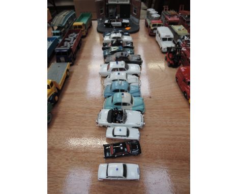 Fourteen  modern Corgi, Vanguard and similar die-cast police cars and a display stand