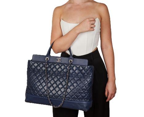 CHANEL QUILTED SHOPPING CHAIN TOTE BAG Condition grade C+. Navy blue quilted leather exterior with exterior slip pockets at f