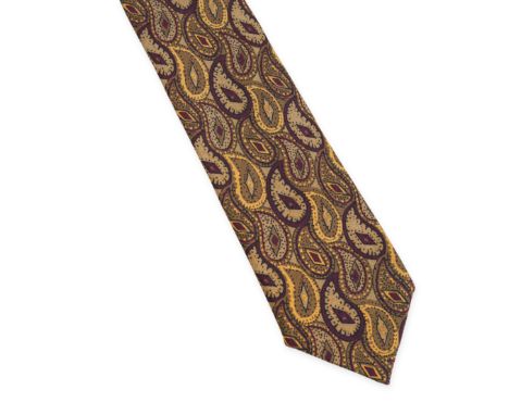 NO RESERVE CHANEL PATTERNED TIE Condition grade B+. Brown background with dark red, black and yellow patterns. 100% silk. Mad