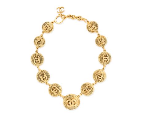 CHANEL VINTAGE MEDALLION NECKLACE Comprising eleven graduating textured circular medallions with interlocking CC logos, and a