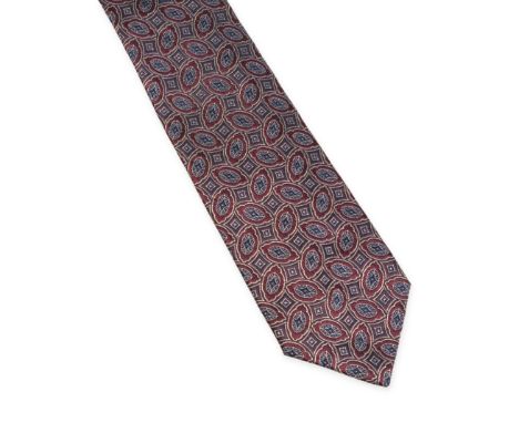 NO RESERVE CHANEL PATTERNED TIE Condition grade B+. Dark red, beige and blue abstract patterns. 100% silk. Made in Italy. Dim