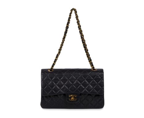 CHANEL MEDIUM BLACK LAMBSKIN DOUBLE FLAP BAG Condition grade B. Black quilted lambskin leather exterior with an outer slip po