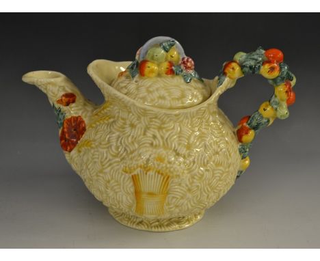 A Clarice Cliff Celtic Harvest globular teapot and cover, by Newport Pottery Co, in relief with wheatsheaves and corn ears, f