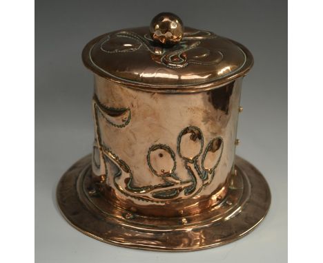 An Arts and crafts copper cylindrical  tobacco jar and cover, repousse chased with stylised organic motifs and sinuous stems,