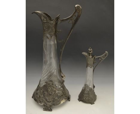 A W.M.F. Jugendstil type pewter mounted cut glass ewer, embossed with foliate scrolls and circular portrait cameos, ornate op