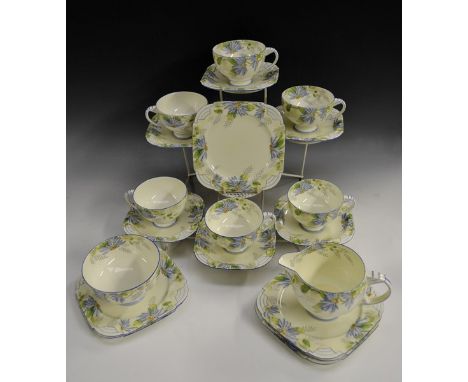 An Art Deco Royal Paragon tea set, comprising six teacups, six saucers, six tea plates, milk and sugar, printed and painted w
