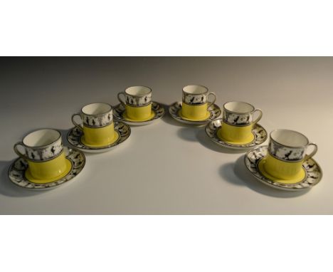 A set of six Foley China  coffee cans and saucers, decorated in black with Pan, children and fairies, above a yellow band, pr