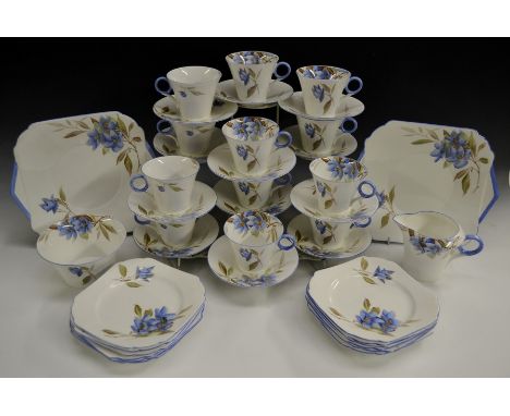 A Shelley Regency tea service, comprising of teacups, saucers, side plates, two bread and butter plates, milk jug, sugar bowl