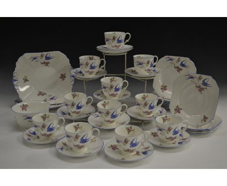 A Shelley Late Empire shape Bluebird pattern tea set, comprising eleven teacups, twelve saucers, twelve tea plates, sugar bow