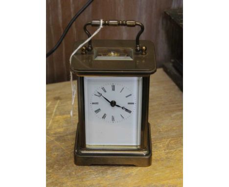 A 20TH CENTURY BRASS CASED CARRIAGE CLOCK, white enamel dial with Roman numerals, 8-day movement with key, 11cm high 