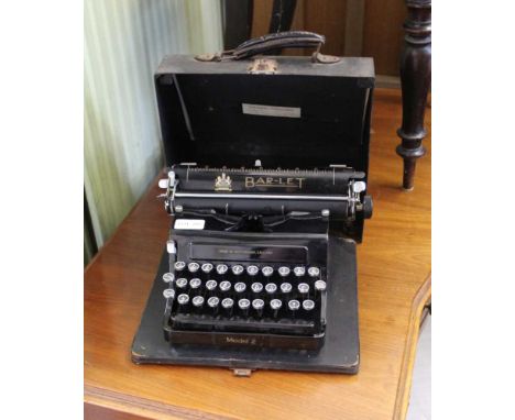 A VINTAGE CASED MANUAL TYPEWRITER the bar-let model 2, made in Nottingham 