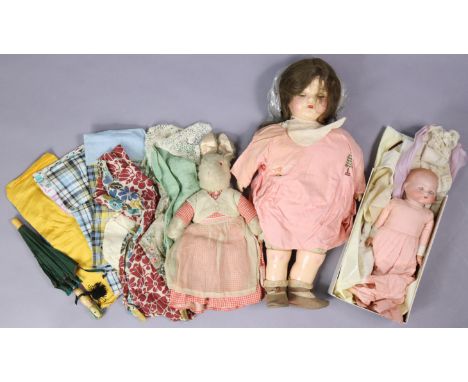 An Armand Marseille bisque head baby doll (A. M. Germany), 11” tall, dressed; together with a celluloid doll; various items o