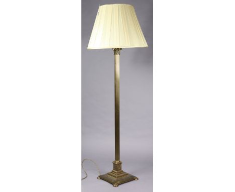 A brass Corinthian-style standard lamp, on a square stepped base, with shade, 66” high.