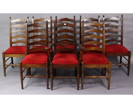 A set of eight ladder-back dining chairs (including one carver) with padded drop-in-seats, &amp; on turned legs with spindle 