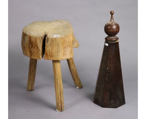 A wooden chopping block on three round legs, 13½” wide x 18½” high, &amp; a mahogany bedpost finial, 24” high.