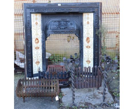 A cast-iron fire surround inset with a tile border, 38” wide x 39” high; &amp; three iron fire baskets.