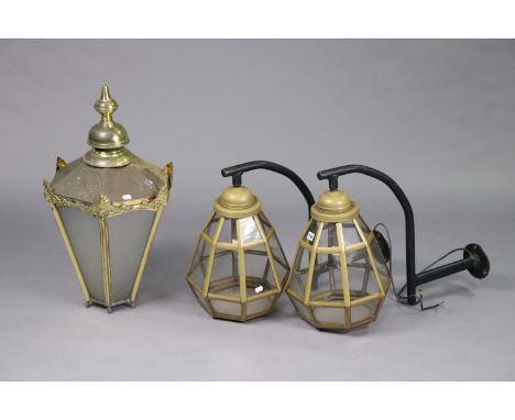 A pair of Inn lanterns of octagonal tapered form, 19” high, with brackets; &amp; a brass lantern of six-sided form, 28½” high