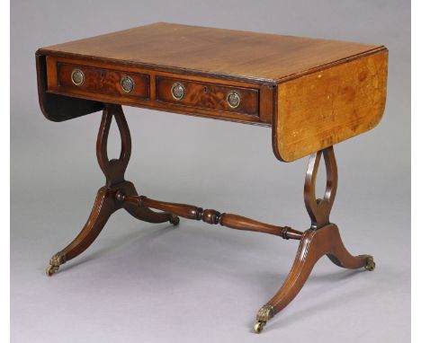 A regency mahogany sofa table with crossbanded top &amp; rounded corners to the drop-leaves, fitted two frieze drawers with b