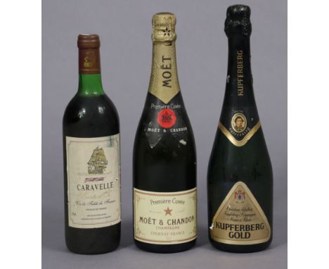 A bottle of Moet et Chandon champagne, a bottle of Kupferberg Gold sparkling wine, &amp; a bottle of Caravelle wine, each wit