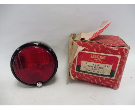 A Lucas new old stock type ST38 12 volt porkpie lamp.
